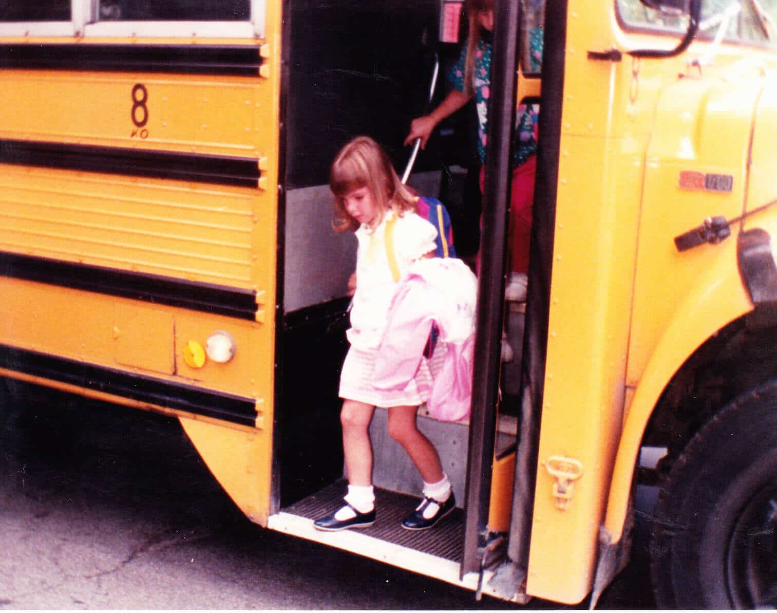 Laura getting off school bus
