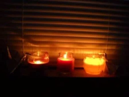 candles burning in window