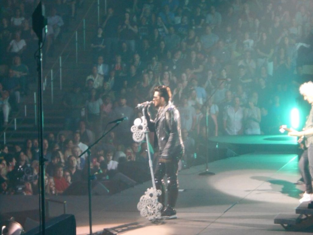 Adam belting out a song in his leather costume.