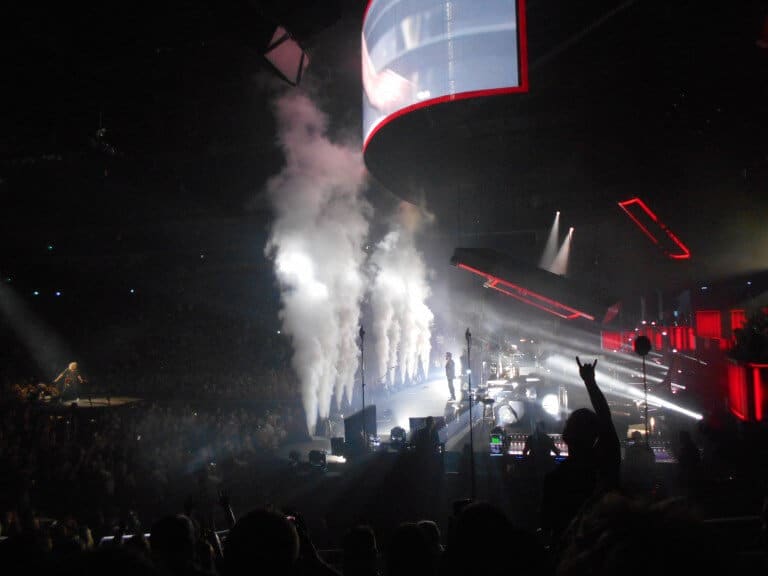Smoke shoots out of the stage during the end of the concert.