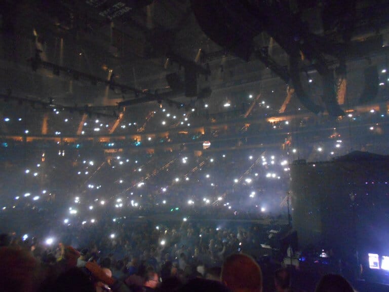Camera phone lights from the audience.