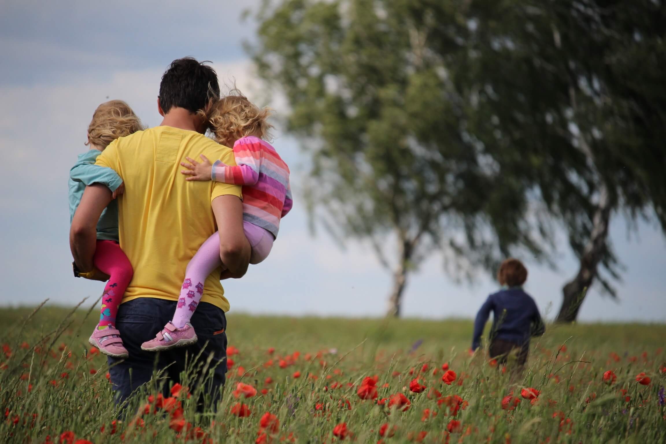 parent holding kids