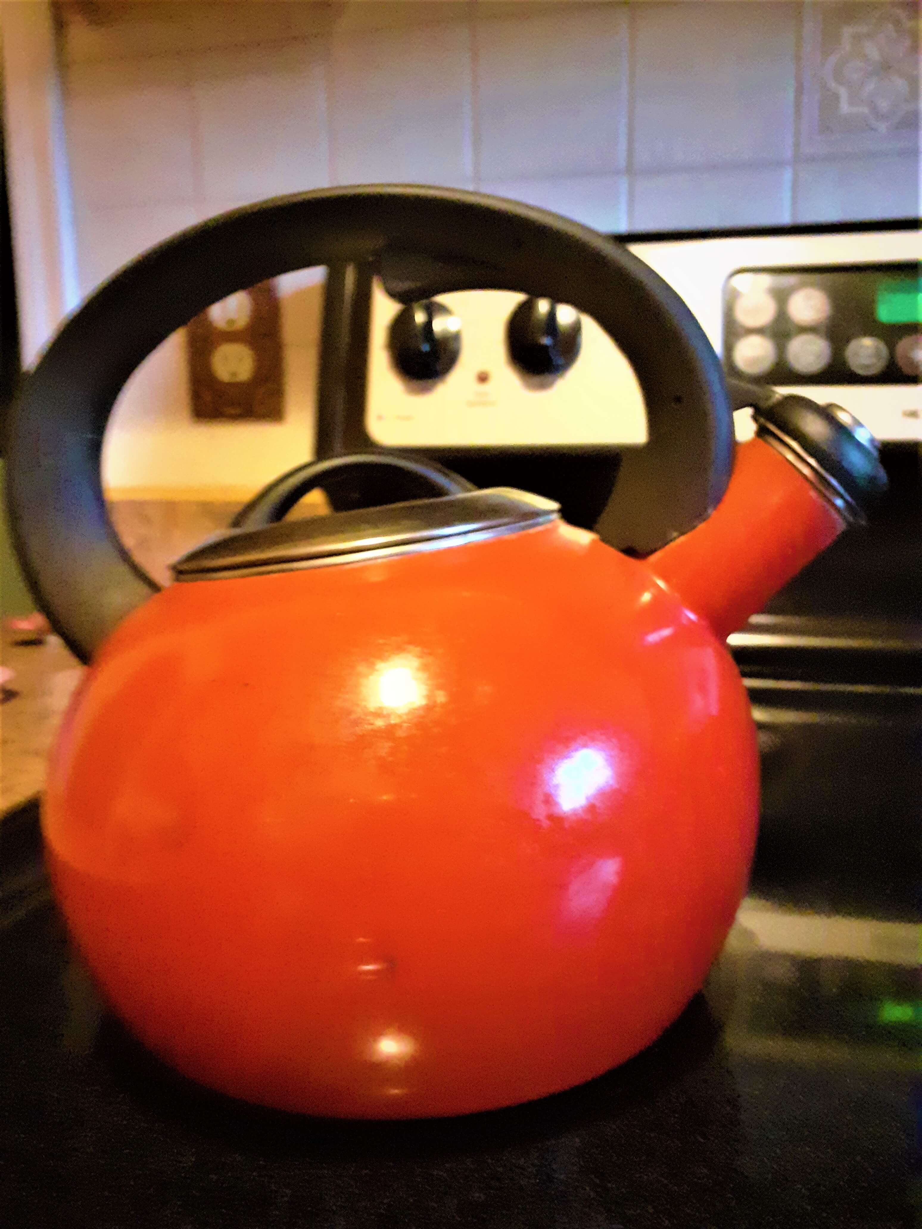 Tea kettle on a stove.